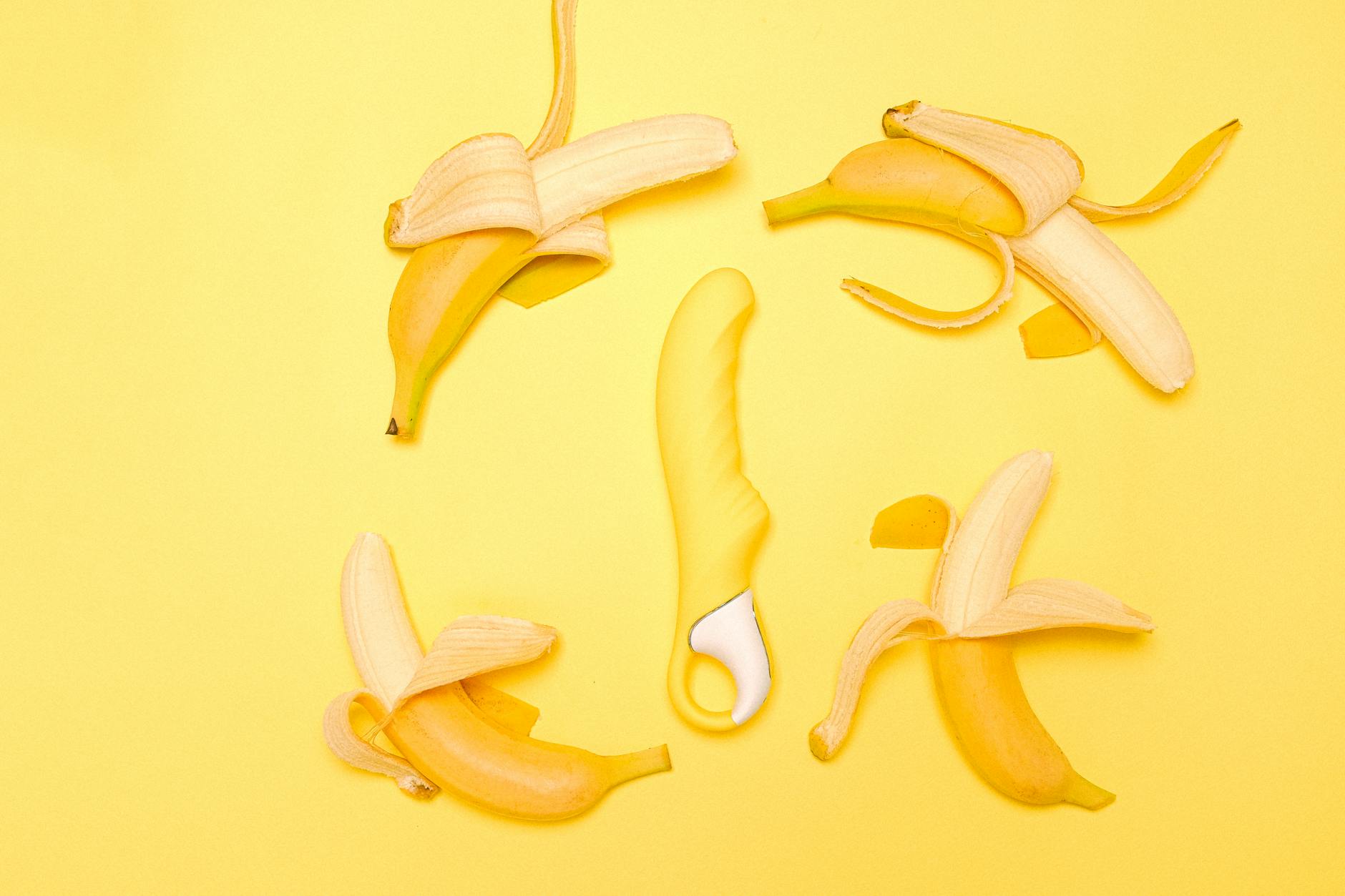A yellow lemon vibrator on a bright yellow background, symbolizing restored pleasure.